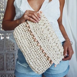 NWT Aruba natural straw clutch w/peach pom poms